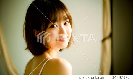Young woman photographed in a studio 134597922