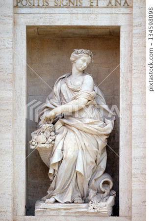 The statue of Abundance of the Trevi Fountain in Rome. Fontana di Trevi is one of the most famous landmark in Rome, Italy. 134598098