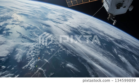 Satellite in orbit above Earth capturing stunning view of blue planet and clouds Satellite in orbit above Earth capturing stunning view of blue planet and clouds 134599899