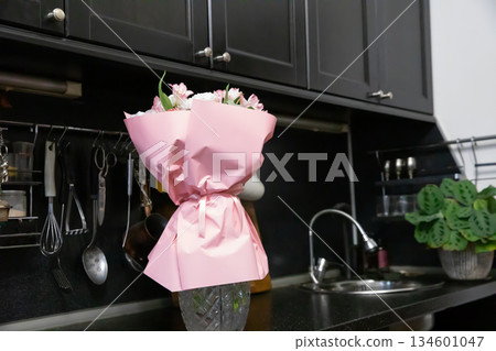 Pink Flower Bouquet in Modern Kitchen Setting 134601047