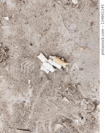 cigarette butts thrown carelessly 134601145