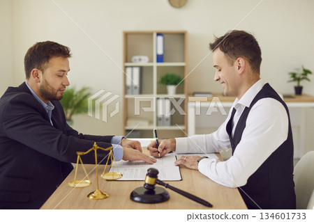 Paper signing client at lawyer consultant providing professional advice, counsel to business 134601733
