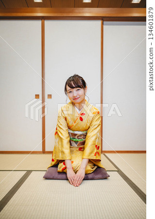 A beautiful young kimono woman posing in a Japanese-style room 134601879