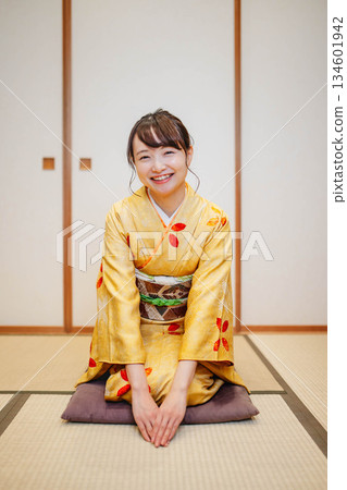 A beautiful young kimono woman posing in a Japanese-style room 134601942