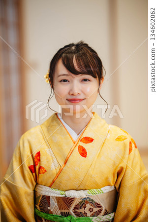 A young woman wearing a kimono sitting in a Japanese-style room A young woman wearing a kimono sitting in a Japanese-style room 134602062