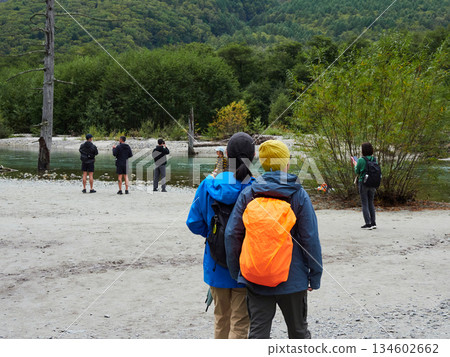 The scenery of the Azusa River in Kamikochi, a popular tourist spot, and tourists strolling along the river 134602662