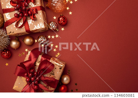 Border from Gold Wrapped Christmas Gifts with Red Ribbons and Ornaments on Red Background Border from Gold Wrapped Christmas Gifts with Red Ribbons and Ornaments on Red Background 134603081