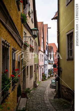 Charming medieval alley with colorful houses in Rothenburg ob der Tauber old town 134603284