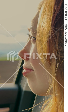 Smiling girl in auto, looking out window, nature background, happiness on face, traveling excitement, sunlight through glass, beautiful scenery, positive mood, peaceful travel, adventure begins, Woman Smiling girl in auto, looking out window, nature background, happiness on face, traveling excitement, sunlight through glass, beautiful scenery, positive mood, peaceful travel, adventure begins, Woman 134603881