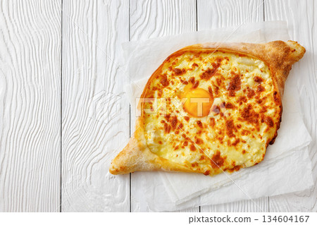 Adjarian Khachapuri with egg yolk and cheese 134604167