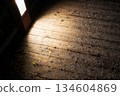 Wooden floor illuminated by footlights and falling snow 134604869