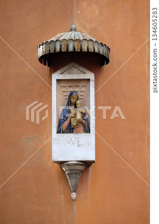 Ave Maria Image of Virgin Mary with baby Jesus on the facade of a palace in Rome, Italy Ave Maria Image of Virgin Mary with baby Jesus on the facade of a palace in Rome, Italy 134605283