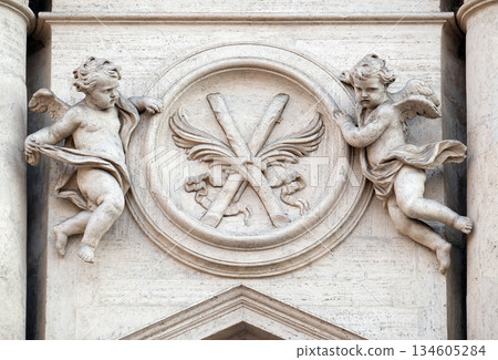 Angels with symbols of martyrdom on the portal of Sant Andrea della Valle Church in Rome, Italy Angels with symbols of martyrdom on the portal of Sant Andrea della Valle Church in Rome, Italy 134605284