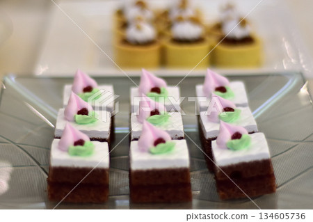 Decorative Dessert Squares on Glass Plate Decorative Dessert Squares on Glass Plate 134605736