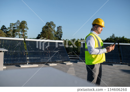 Professional man monitoring renewable energy system 134606268