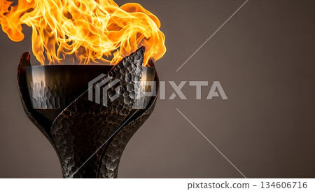 Close-up of a burning torch with a textured metal base against a neutral background 134606716