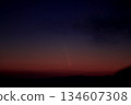 A bright comet at dusk in 2024 134607308