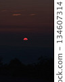 A crimson sunrise seen from the mountains 134607314
