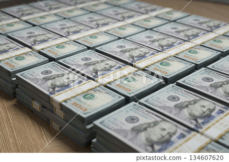 Stacks of hundred-dollar bills, symbolizing finance, wealth, accounting, investment, and business success. Perfect concept for banking, savings, and economic growth. Americans Dollars. Money 134607620