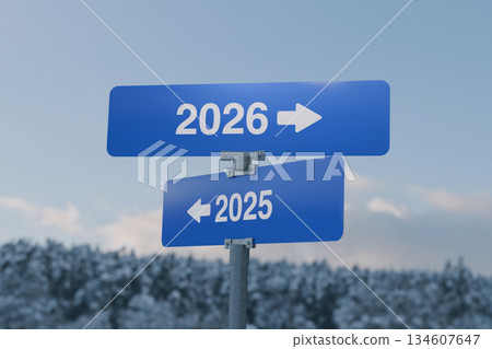Blue road signs showing 2025 pointing left and 2026 pointing right, symbolizing the transition between years and the concept of future direction and new beginnings. Winter background. 2026, concept 134607647