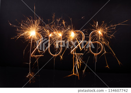 2026 Sparklers Celebration. Sparkling numbers 2026 on dark background 134607742