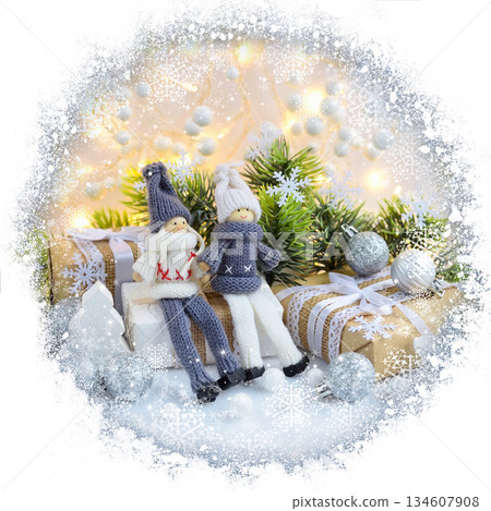 Christmas or New Year greeting card. Christmas composition with toys dolls and spruce branches Christmas or New Year greeting card. Christmas composition with toys dolls and spruce branches 134607908