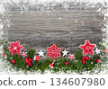 Christmas decorations and spruce branches on a wooden table. Festive background. Top view 134607980