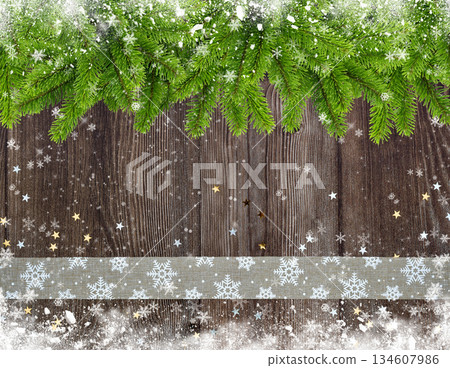 Christmas or New Year greeting card. Branches of spruce and ribbon with snowflakes and golden star 134607986