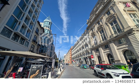 A narrow street with shops in the city of Brussels 134608071
