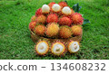 Pile of Rambutan fruit in basket, showing white flesh and seed. Tropical fruit, Harvest season  134608232