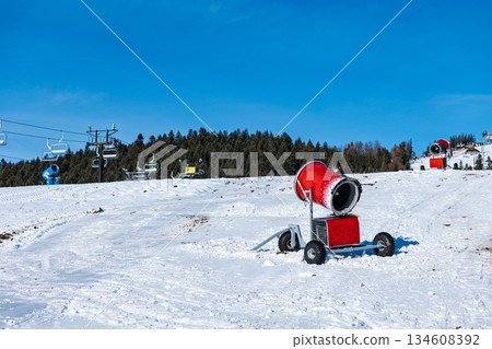 Comprehensive winter resort scene featuring ski slopes, snow cannons, chairlifts, mountain panoramas, and detailed snow texture. Ideal for alpine travel and infrastructure. 134608392
