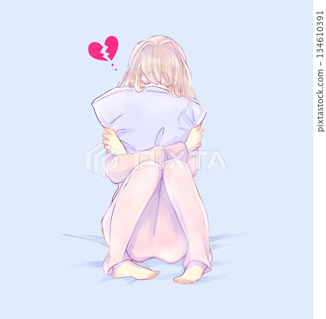 Woman holding a broken heart cushion on the bed Woman holding a broken heart cushion on the bed 134610391