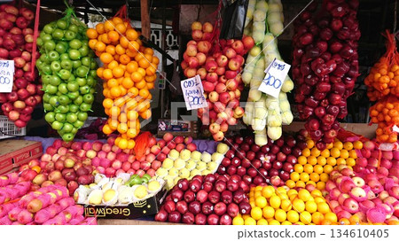 A local Asian market lined with colorful fruits A local Asian market lined with colorful fruits 134610405