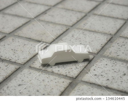 Aerial view of a miniature car placed on a tiled floor Aerial view of a miniature car placed on a tiled floor 134610445