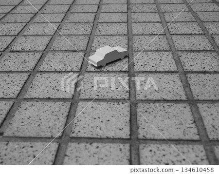 Aerial view of a miniature car placed on a tiled floor Aerial view of a miniature car placed on a tiled floor 134610458
