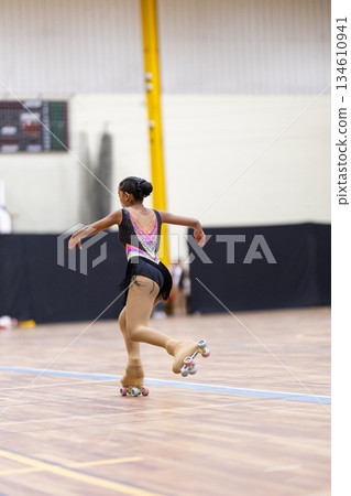 Young girl performing artistic roller skating routine Young girl performing artistic roller skating routine 134610941