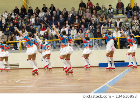 Athletes performing artistic roller skating routine Athletes performing artistic roller skating routine 134610958