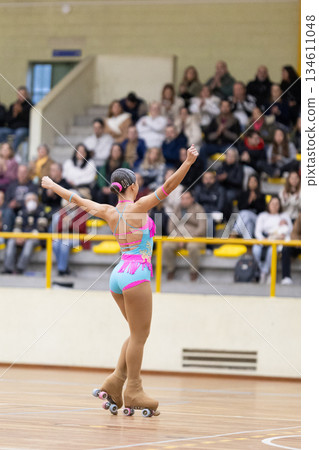 Female roller skater performing artistic routine for audience Female roller skater performing artistic routine for audience 134611048