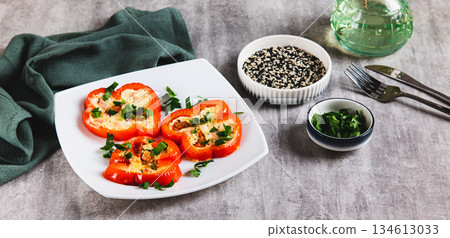 Fried red bell pepper rings with omelette and herbs on a plate on the table web banner Fried red bell pepper rings with omelette and herbs on a plate on the table web banner 134613033