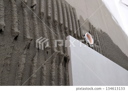 Wall ceramic tiles installation on mortar glue. Wall ceramic tiles installation on mortar glue. 134613133