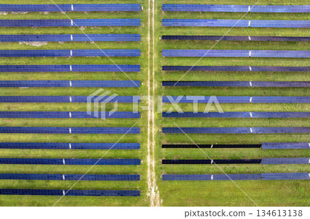 View from above of photovoltaic power plant with many rows of solar panels for producing clean electrical energy. Concept of renewable electricity with no air pollution 134613138