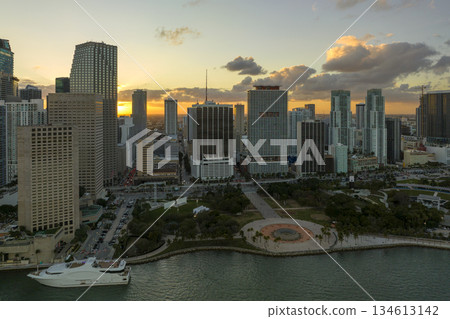 View from above of high skyscraper buildings in downtown district of Miami Brickell in Florida, USA at sunset. American megapolis with business financial district at nightfall View from above of high skyscraper buildings in downtown district of Miami Brickell in Florida, USA at sunset. American megapolis with business financial district at nightfall 134613142
