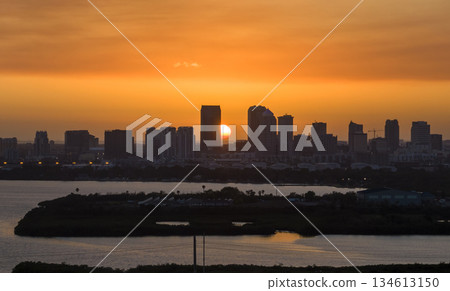 View from above of contemporary high skyscraper buildings in downtown district of Tampa city in Florida, USA at sunset. American megapolis with business financial district 134613150