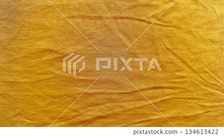 vibrant mustard yellow corduroy fabric texture closeup showcasing soft wrinkles and subtle sheen for elegant wallpaper or design banner background 134613422