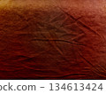 warm rusty red fabric texture gradient with subtle folds and wrinkles evokes earthy autumn mood abstract background ideal for wallpaper or design banner with copy space 134613424