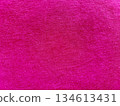 vibrant hot pink textured fabric closeup with pastel blue copy space for banner wallpaper or editorial background 134613431