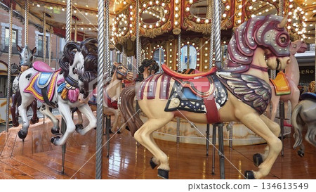 Colorful carousel horses at a festive christmas market. Christams and New Year in Madrid, Spain Colorful carousel horses at a festive christmas market. Christams and New Year in Madrid, Spain 134613549