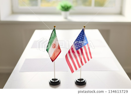 Iran and USA table flags set for diplomatic meeting on bright conference desk Iran and USA table flags set for diplomatic meeting on bright conference desk 134613729