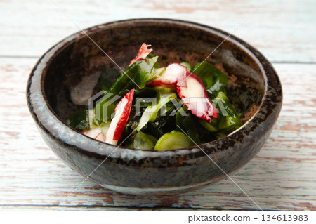 Vinegared octopus, wakame seaweed and cucumber 134613983