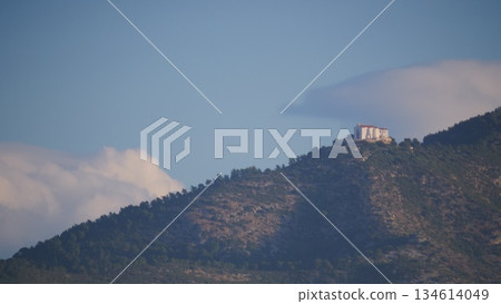 Spanish coast landscape with church on hill 134614049